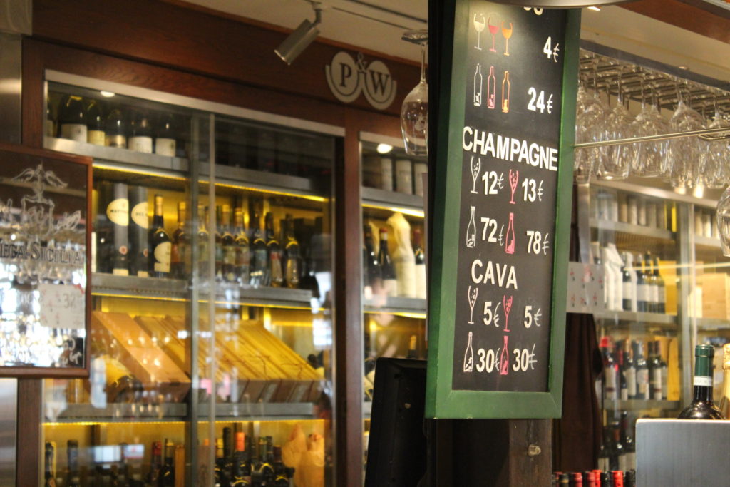 Wine bar showing wine for sale at 4 euros a glass in the MErcado San Miguel